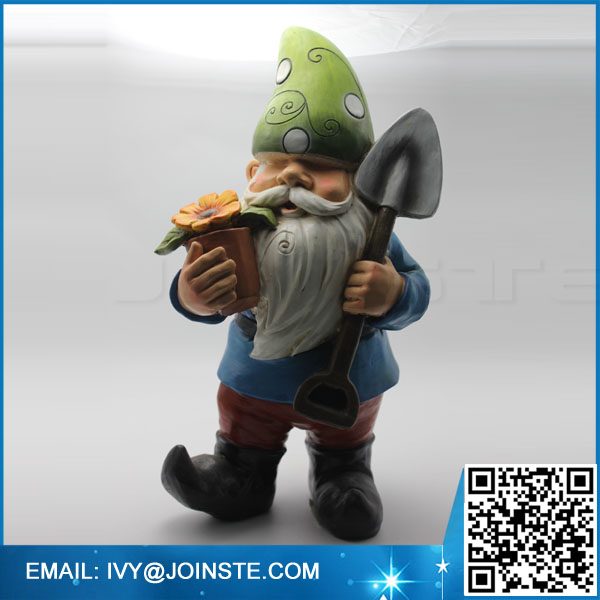 Resin Garden gnome, holder flower and spade gnome statue in garden