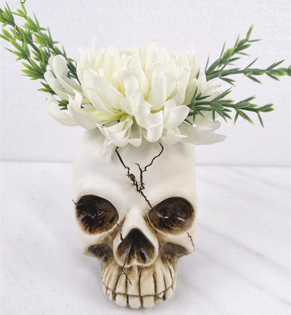 Artificial plant in skull flower pot