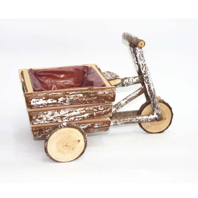 Natural wood bark trike planters with snow