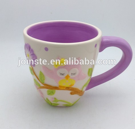 ceramic coffee mug with relief animal painting