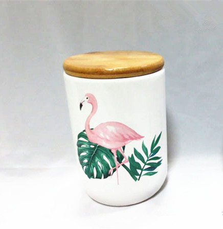 Ceramic palm leaf flamingo decal canister with bamboo lid