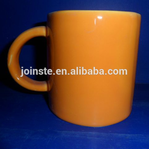 Standard size orange color ceramic coffee mug