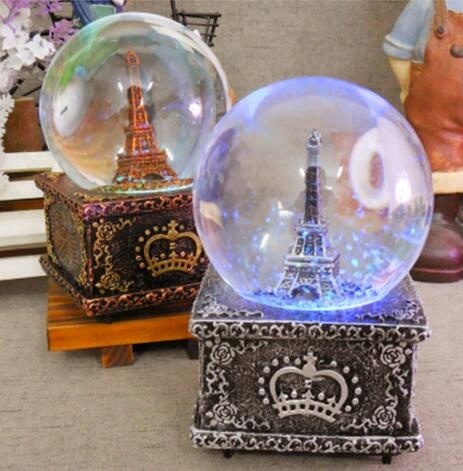 Eiffel tower snowglobes with light and music round for souvenirs