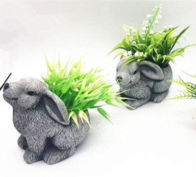 Artificial grass assorted in  cement bunny  flower pot