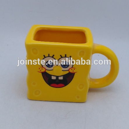 Yellow square shaped handmade painted ceramic mug