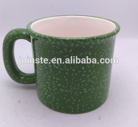 Beautiful green ceramic coffee mug with white dots