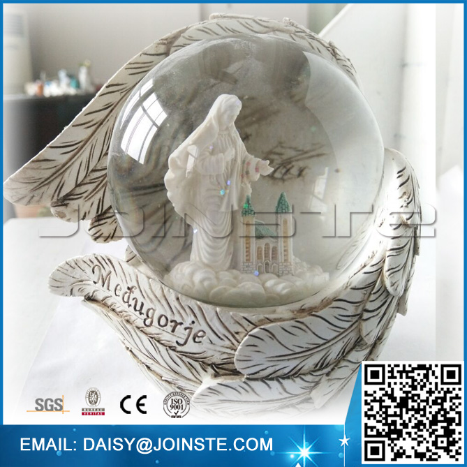 tourist souvenirs with wings Maria snow globes
