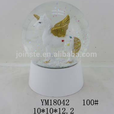 Gold Wing Unicorn snow globes with white base 100mm